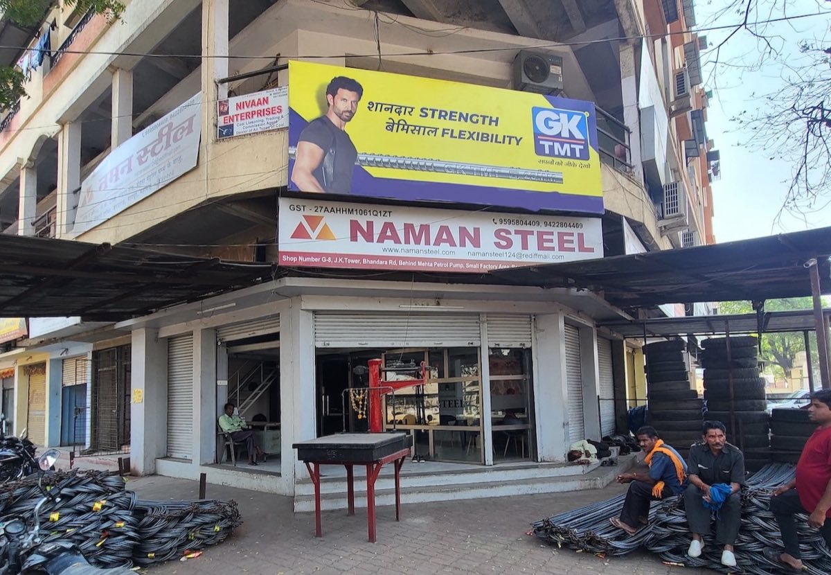 Naman Steel shop front at J.K. Tower, Bhandara Road, with TMT bars stocked outside
